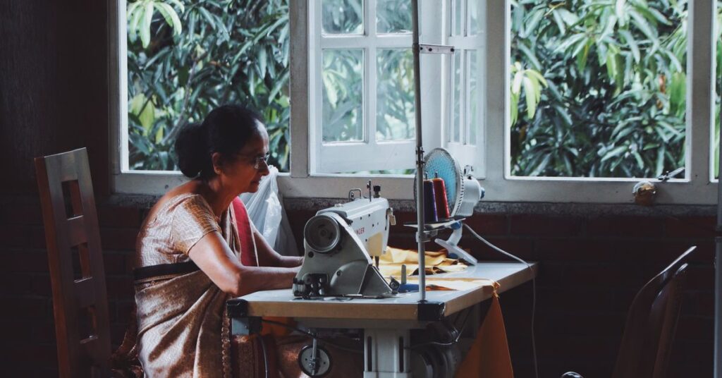 Woman entrepreneur running her own tailoring business, one of many business ideas for women