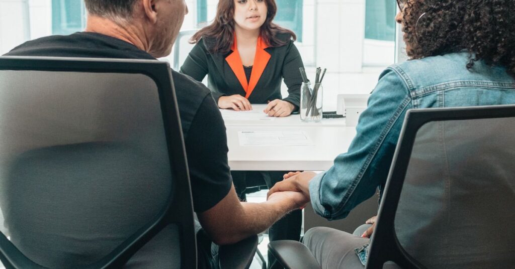 Entrepreneur and banker checking CGTMSE eligibility documents