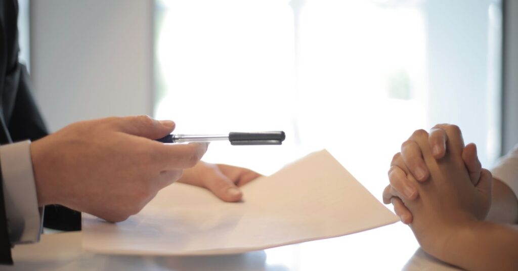Business owner signing a collateral-free loan agreement under the CGTMSE scheme