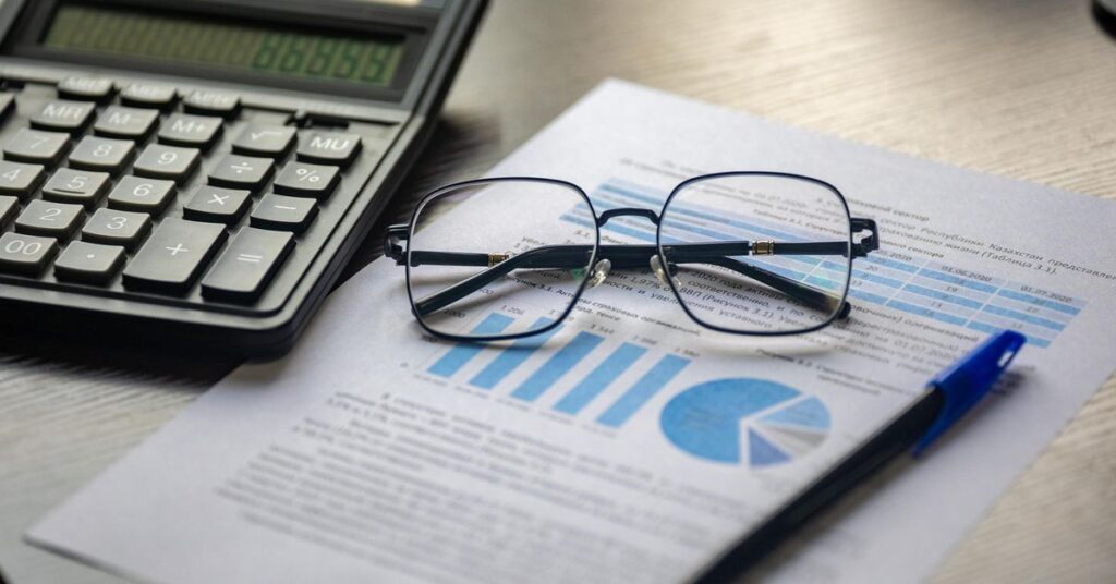 Project report for bank loan with financial charts, calculator and pen