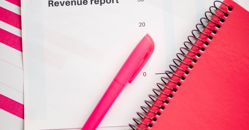 Printed revenue report and notebook, part of a project report format